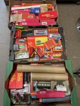 A large collection of model railway carriages and accessories