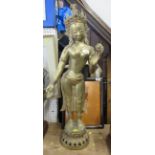 A brass model, of a standing Eastern Deity, height 32ins