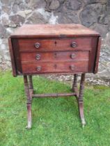 A 19th century work table, fitted with drawers, raised on turned legs united by stretcher, 20ins x