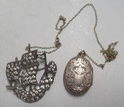 A silver brooch formed as a ship, together with a locket