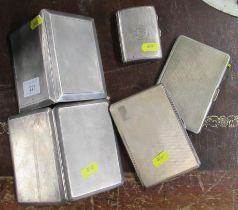 Four silver cigarette cases, weight 20oz together an unmarked cigarette case, and a boxed silver