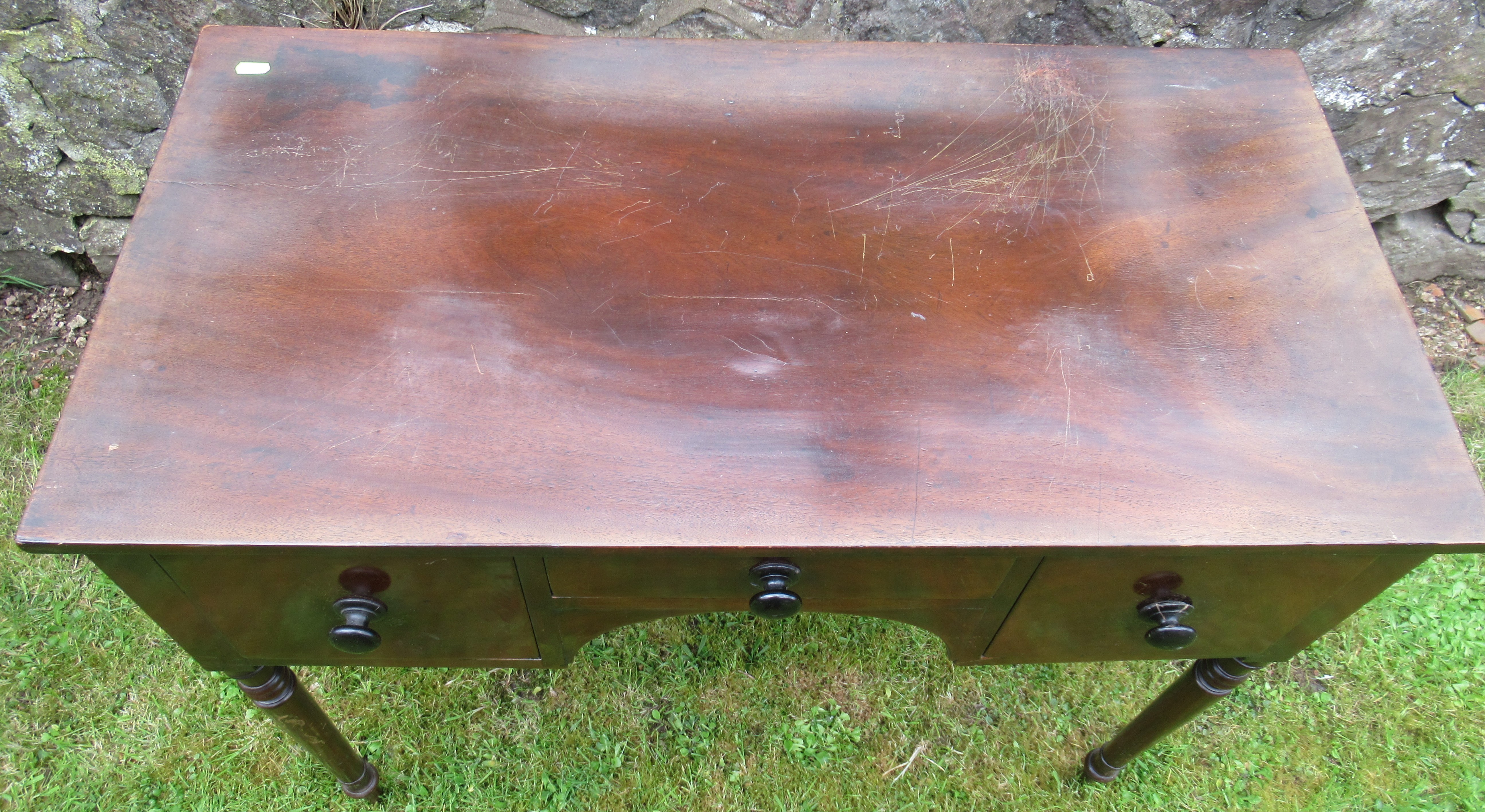 A 19th century mahogany sidetable, fitted with three drawers, on ring turned supports, 36ins x - Image 2 of 3
