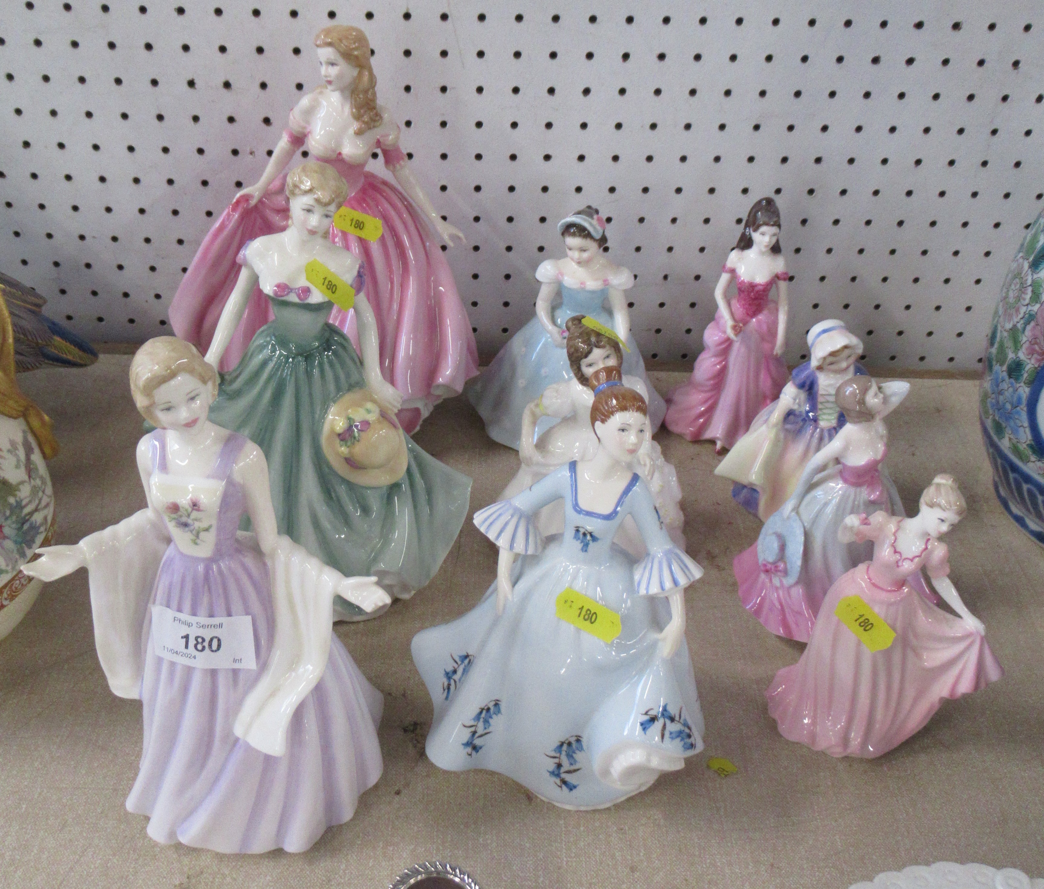 A collection of Royal Doulton figurines, and a Royal Albert figure