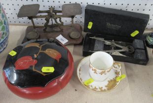 A set of postal scales, a cabinet cup and saucer, a papier mache covered pot and a boxed compass