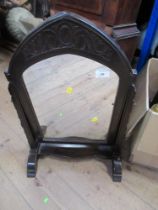 An Arts and Crafts swing frame toilet mirror