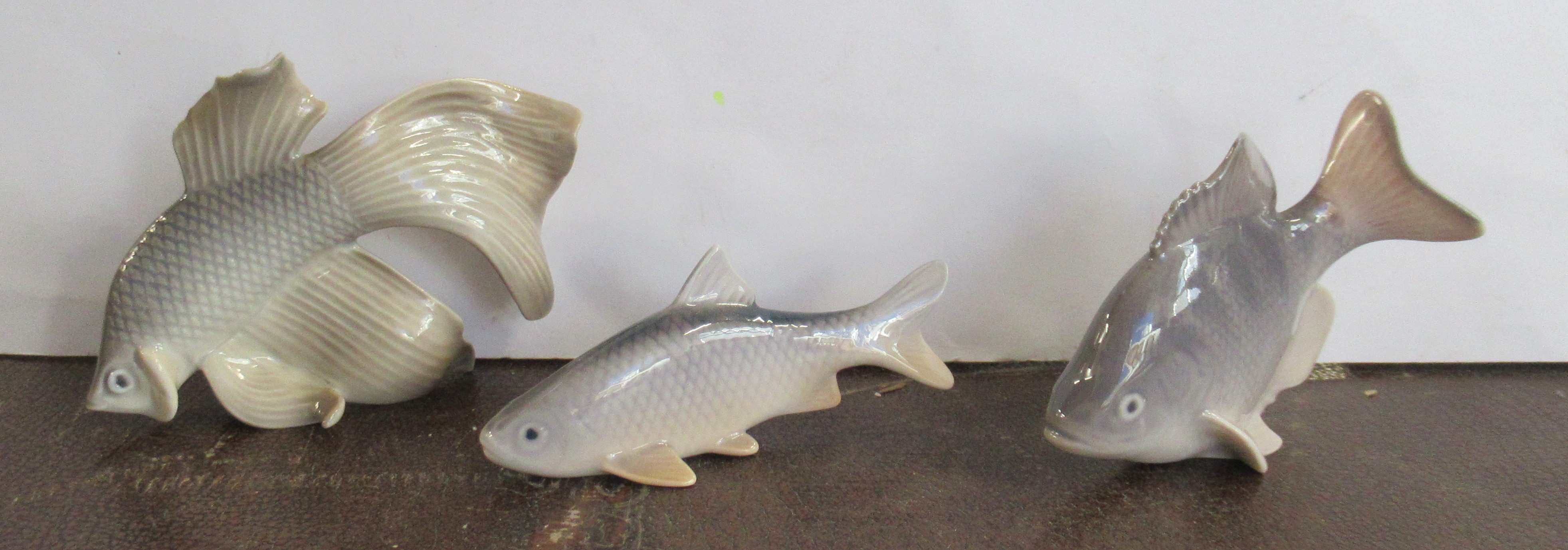 A Royal Copenhagen group, of 2 fish 2933, 3064, together with another Bing and Grondahl model, 2145