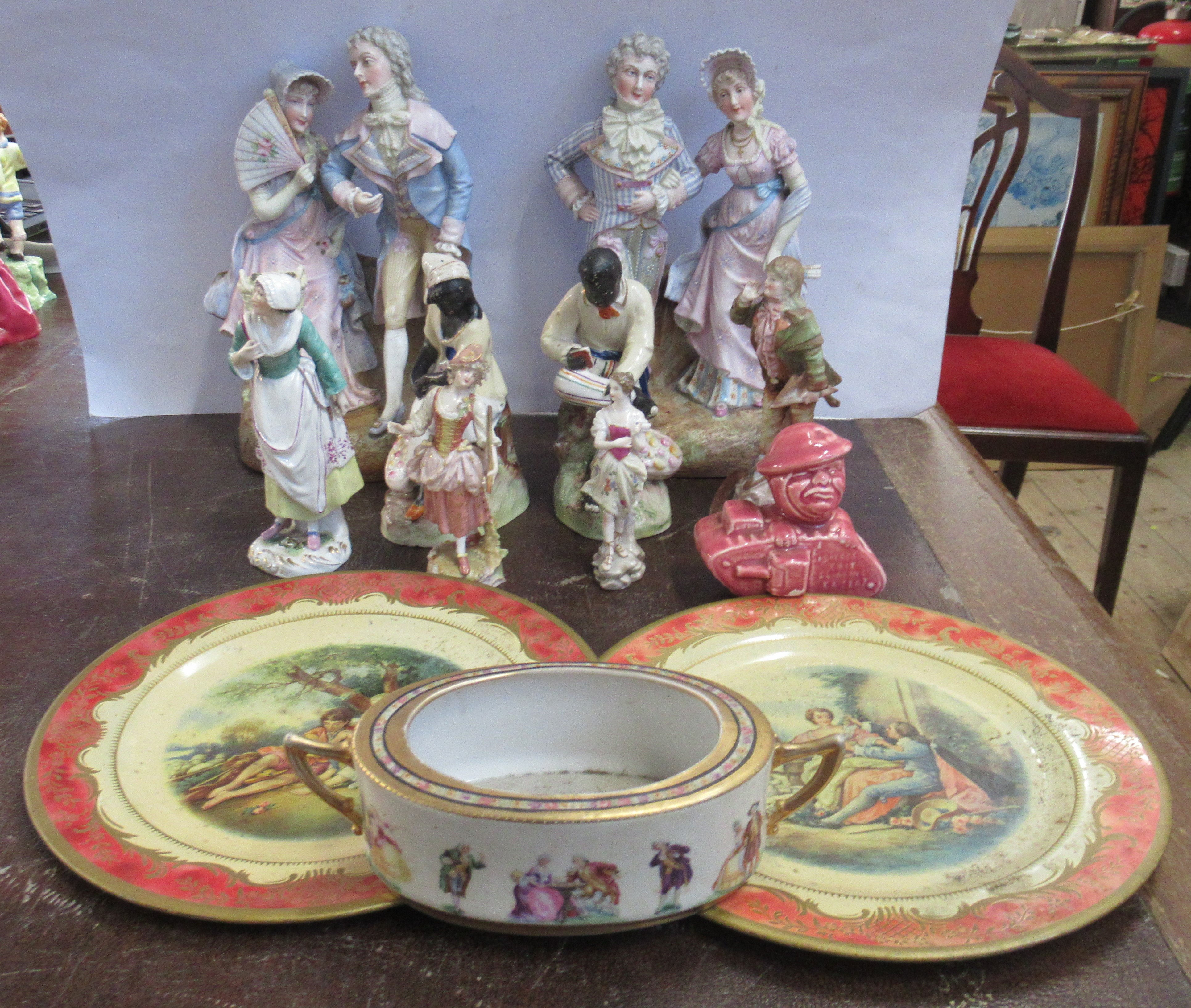 A collection of porcelain figures, and other items Condition Report: The figure holding the hat sold