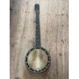 A Banjo with inlaid decoration, missing strings