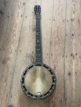 A Banjo with inlaid decoration, missing strings