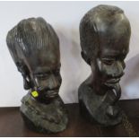 A pair of carved wooden African busts, height 11ins