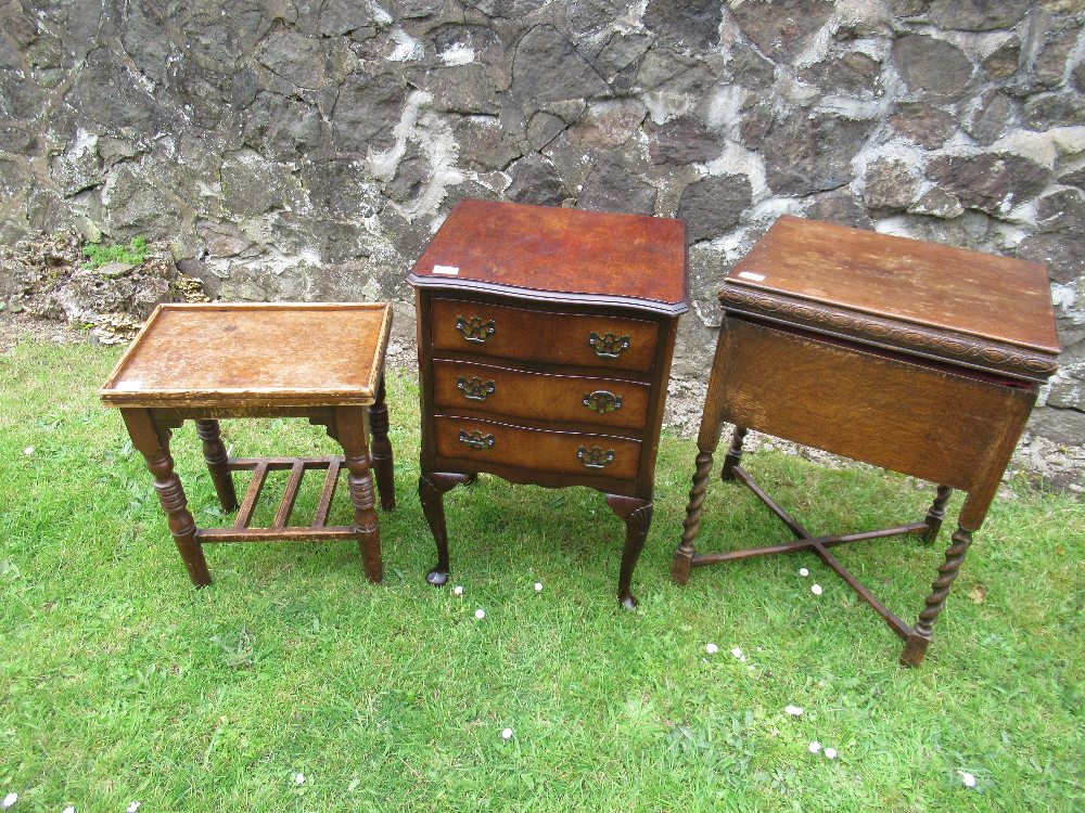A sewing cabinet, chest of drawers and a stool