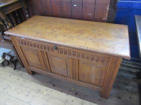 An Antique design oak coffer, width 45ins, height 28ins