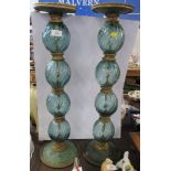 A pair of large glass candlesticks, height 27ins