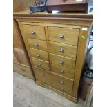 A modern chest of drawers width 35ins, height 54ins, depth 18ins