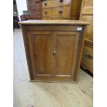 A pine cabinet, width 24ins, height 27ins, depth 14ins