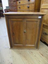 A pine cabinet, width 24ins, height 27ins, depth 14ins