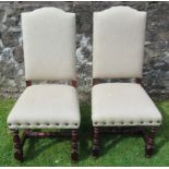 A pair of upholstered dining chairs