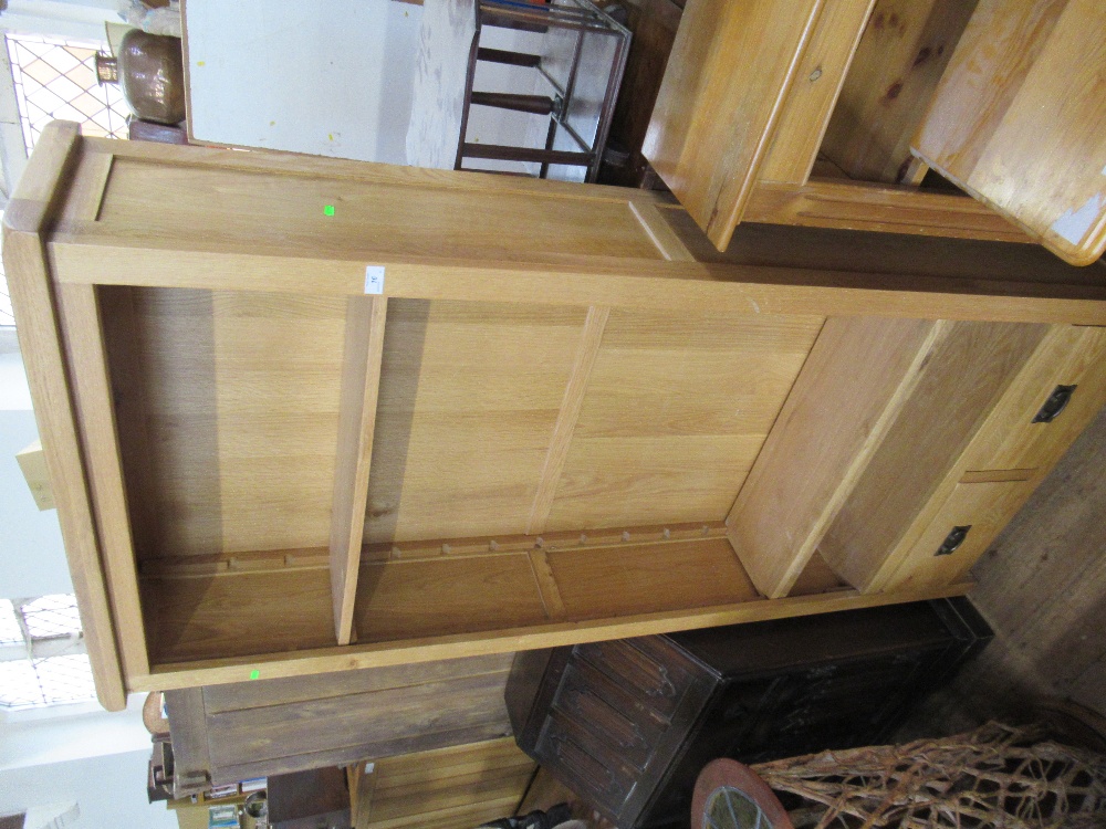 A modern oak set of shelves width 35ins, height 75ins