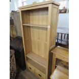 A modern oak set of shelves width 35ins, height 75ins