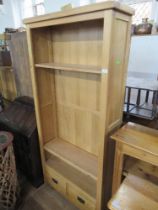 A modern oak set of shelves width 35ins, height 75ins