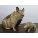 A pottery pig money box, af, height 6ins, together with a resin wild boar