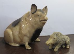 A pottery pig money box, af, height 6ins, together with a resin wild boar