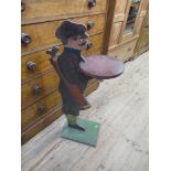 A painted stand, stylised as a golfer, height 37ins