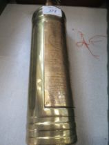 A vintage polished Pyrene fire extinguisher