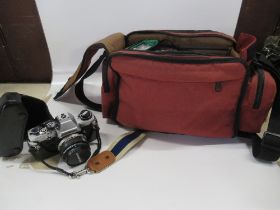 An Olympus camera, box case and accessories