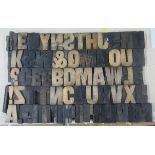 A collection of wooden block printing letters, together with a wine box and brass door plate