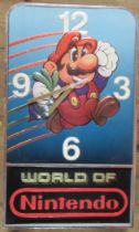 A world of Nintendo Mario wall clock, of rectangular form, 19.5ins x 12ins