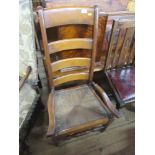 A mahogany ladder back chair