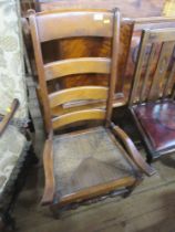 A mahogany ladder back chair