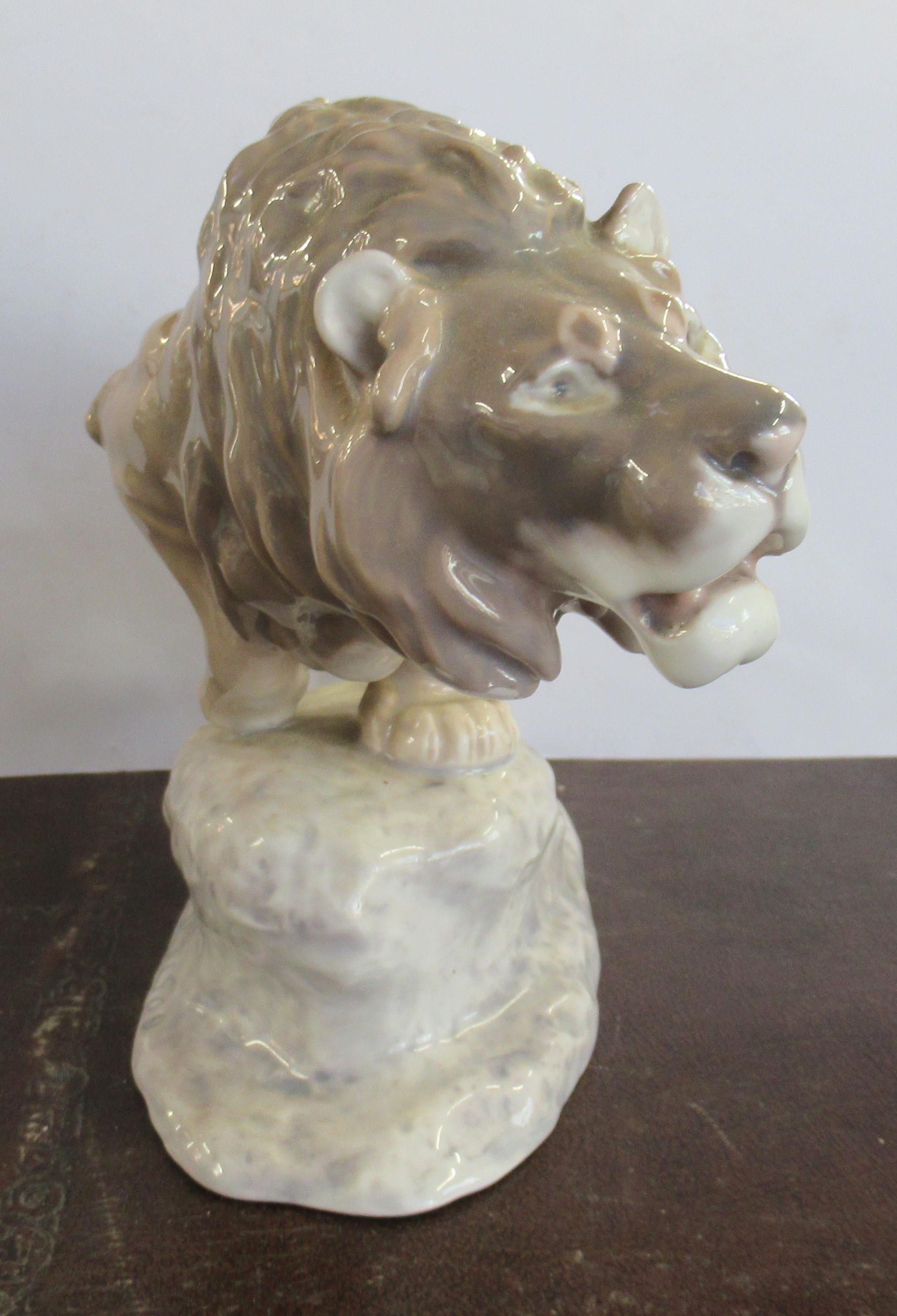 A Bing and Grondahl model, of a male lion on a rock, made before 1940, end of tail missing - Image 3 of 5