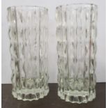 A pair of glass cylindrical vases, with raised decoration, height 9ins