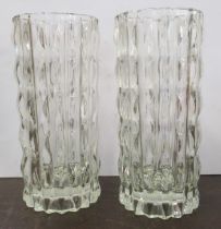 A pair of glass cylindrical vases, with raised decoration, height 9ins