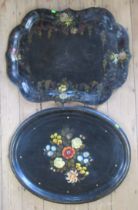 Two 19th century black papier mache trays, one oval, the other shaped rectangular, both decorated