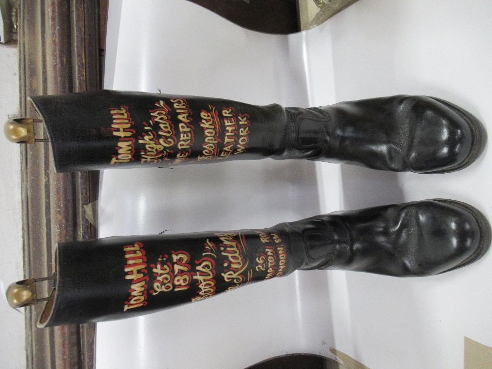 A pair of Riding Boots, with the words, Tom Hill est 1873, boots for riding etc on them