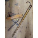 Two walking sticks, hand wood plainer, metal figure and crucifix