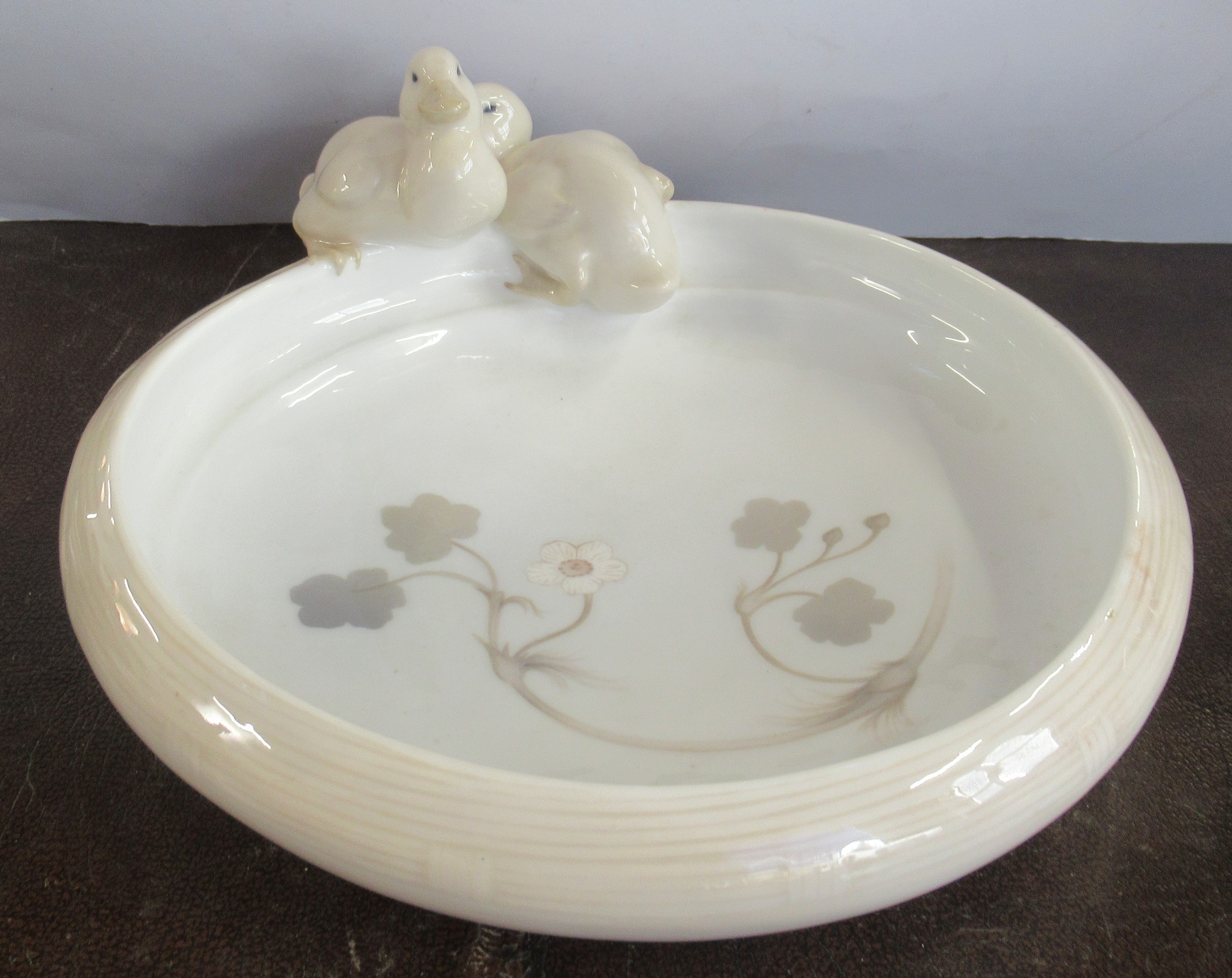 A Royal Copenhagen bowl, decorated with two ducks on the edge, No 358, 10ins wide, made before 1923
