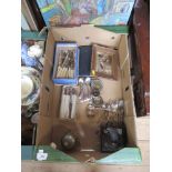 A box of sundries to include silver plate, cutlery , bell, egg timer, Victorian glass bell , over