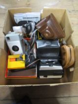A collection of cameras including Instamatic 200, Brownie Vector Camera  (Kodak) An Ilford Sportsman