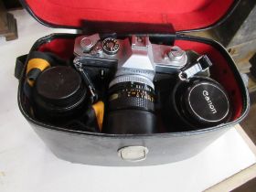 A box Cannon camera and lenses