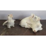 A Royal Copenhagen model, of two pigs, 1468/683,1950's, together with a Bing and Grondahl bird, No