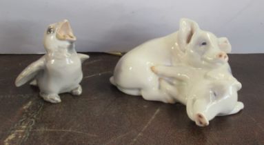 A Royal Copenhagen model, of two pigs, 1468/683,1950's, together with a Bing and Grondahl bird, No