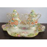 A Coalport Coalbrookdale inkstand, formed as a pair of covered two handled vases on a shaped