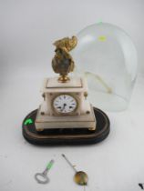 A white marble mantel clock, surrounded by a gilt bust, the movement stamped possibly Marti with a