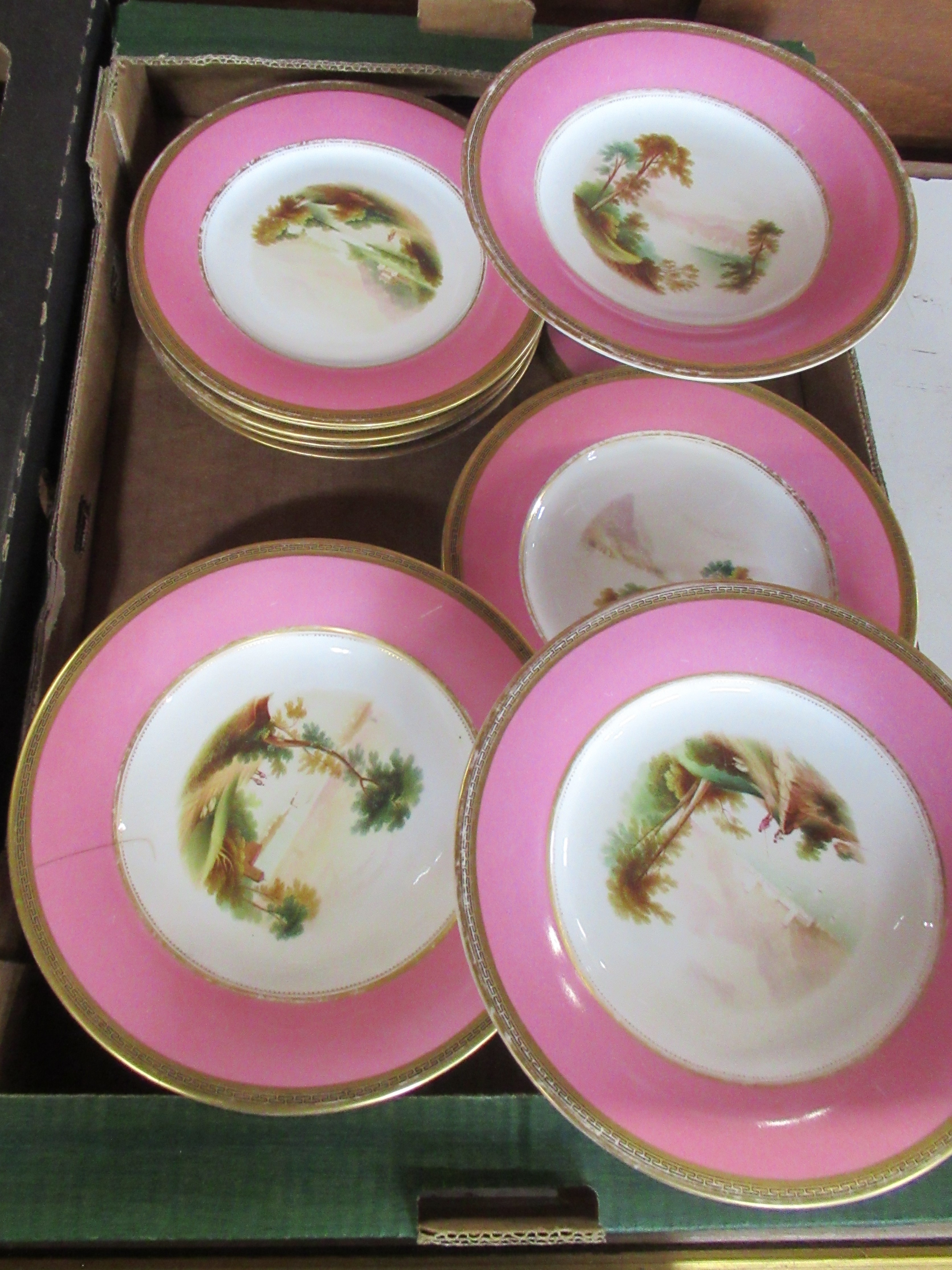 A Continental porcelain dessert service, comprising 11 plates, 2 tall comports and 2 low comports,