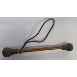 An Antique style drum stick,  with metal ends, length 10ins