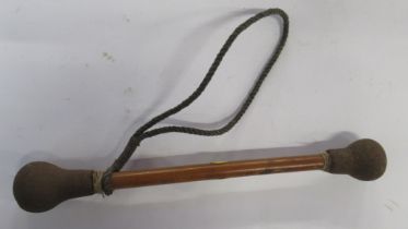 An Antique style drum stick,  with metal ends, length 10ins